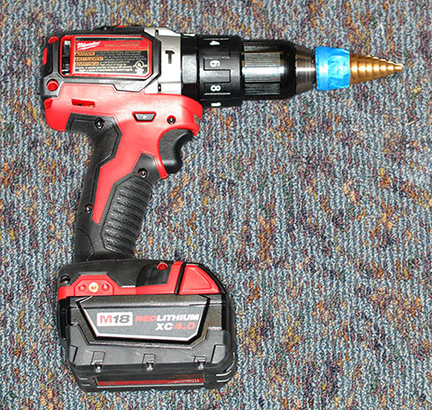 Cordless drill with marked step-drill bit
